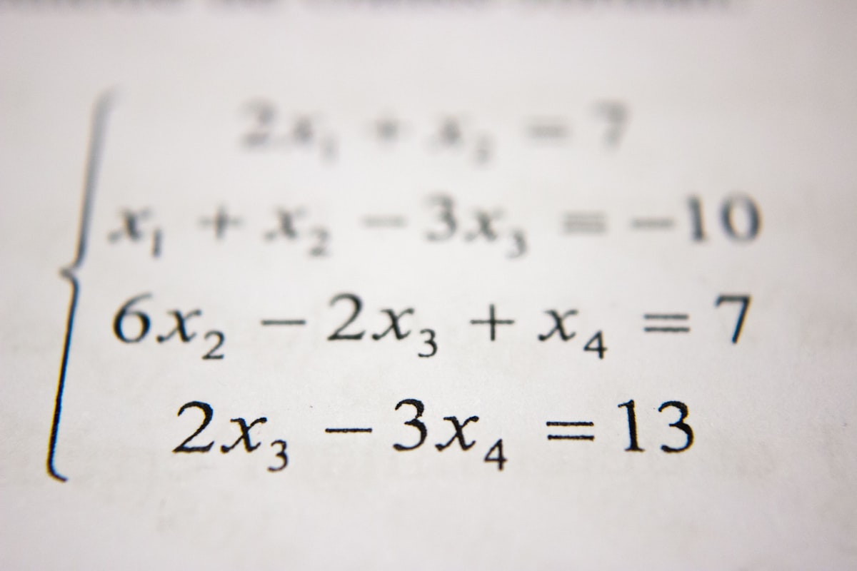 Study desk with mathematical textbooks representing the dedicated practice needed for mathematical fluency