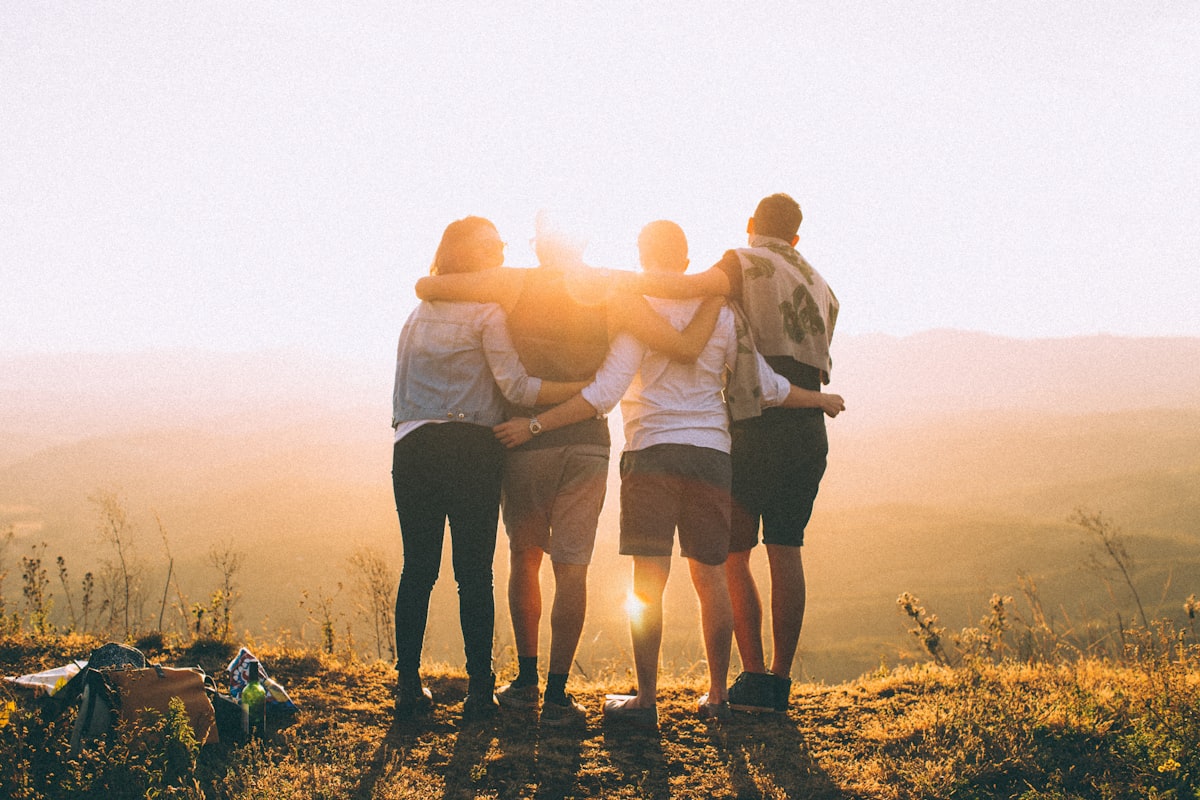A family walking together on a path, representing the shared journey of support