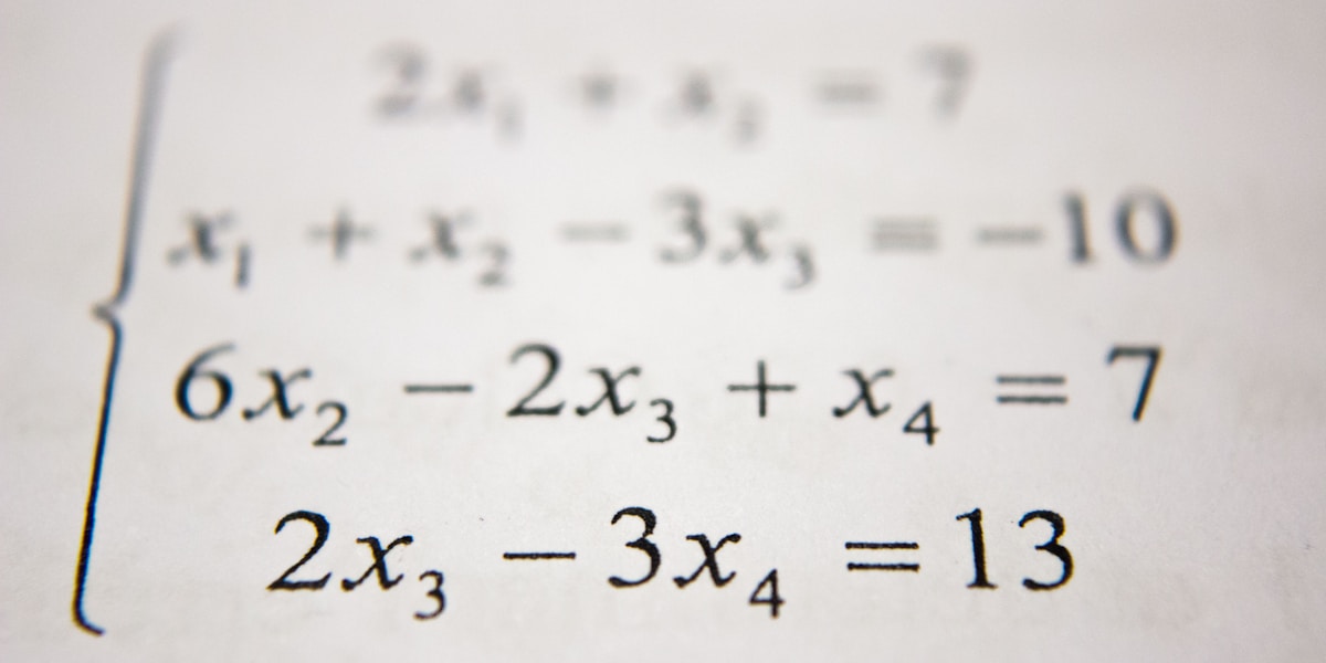 Mathematical equations written on a chalkboard