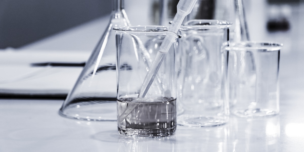 Glass flasks and beakers in a science laboratory