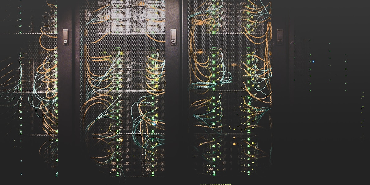 Rows of servers in a glowing data centre