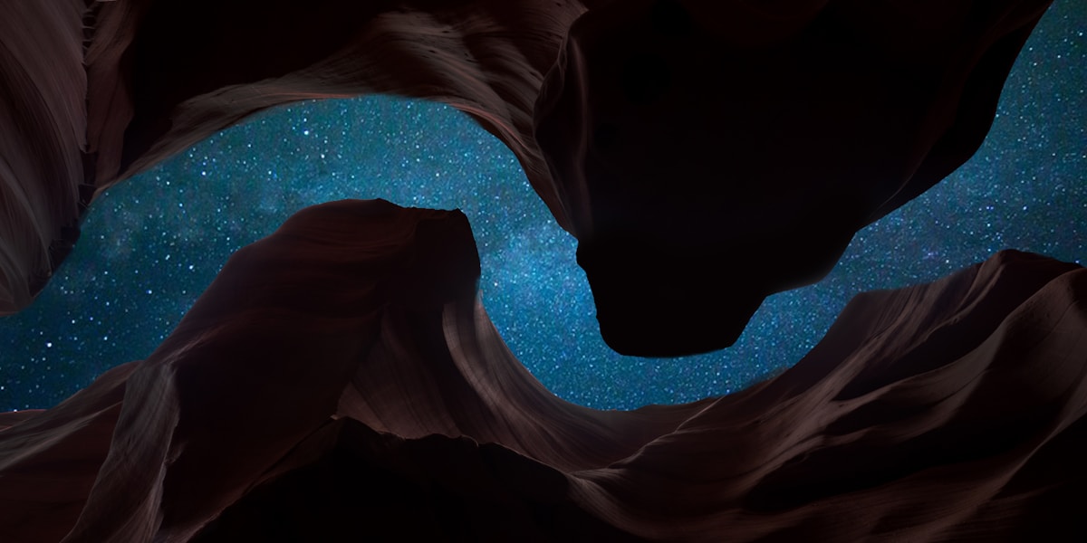 A deep blue night sky scattered with stars