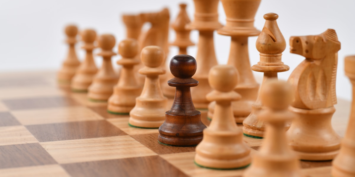 Chess pieces on a board, representing strategic thinking