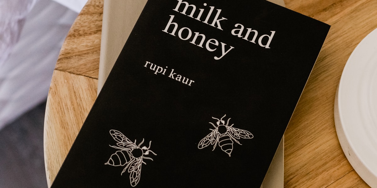 An open book on a wooden table in warm light